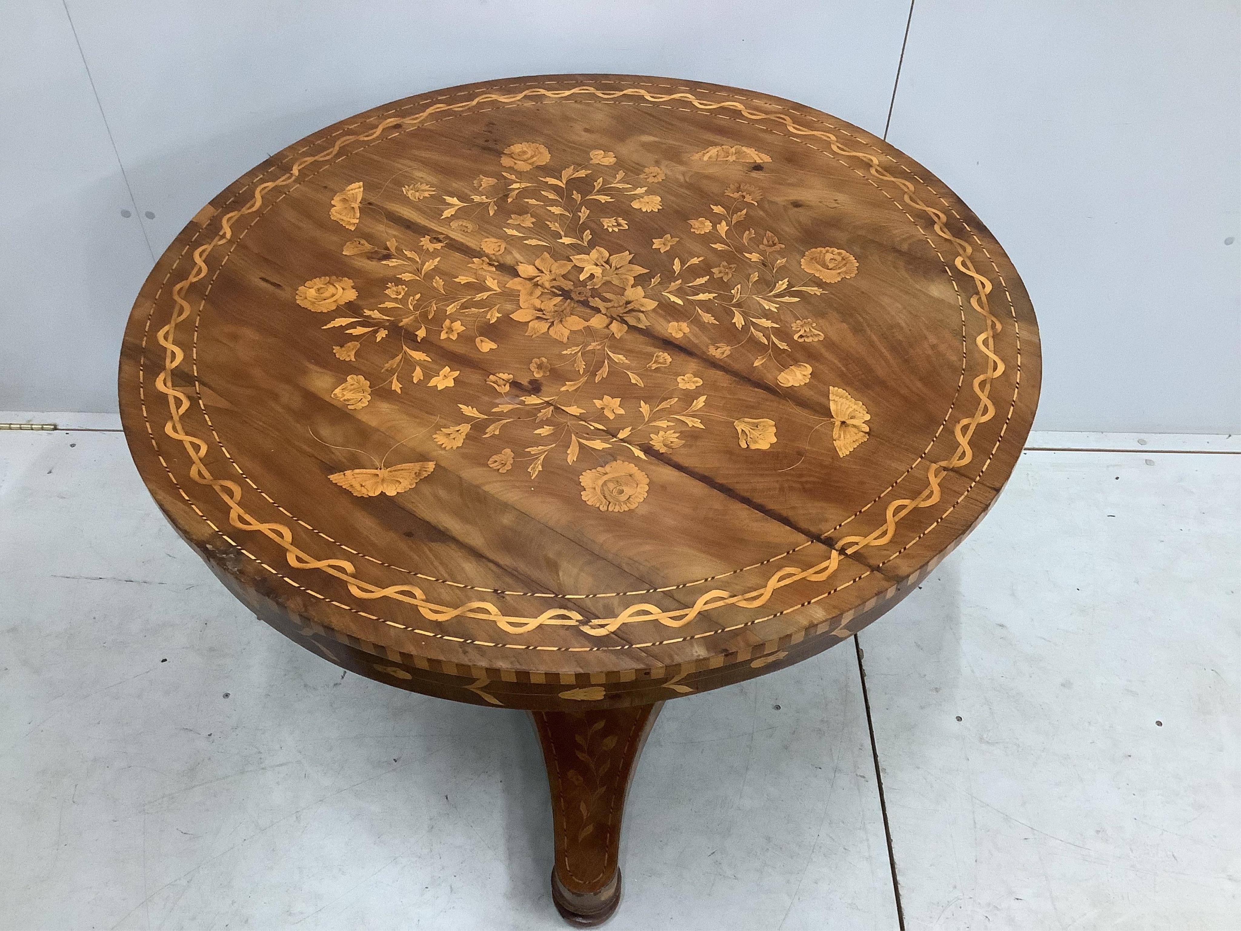 An early 19th century Dutch marquetry inlaid circular walnut centre table, diameter 100cm, height 77cm. Condition - fair, top has several veneer splits